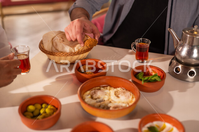 Man Eating Traditional Arabic Breakfast with Tea