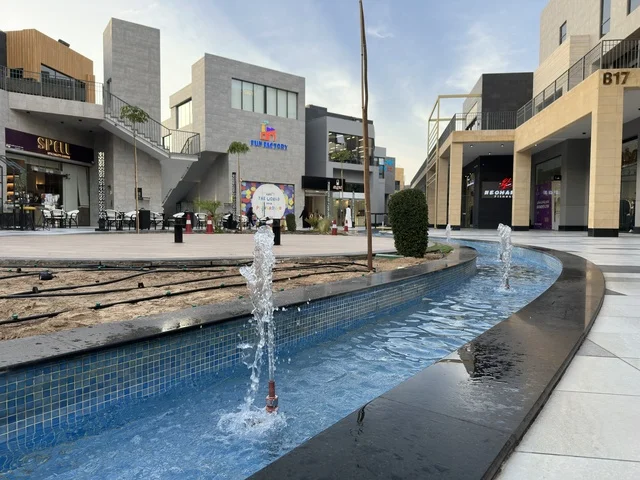 Modern Fountain and Buildings at Shorofat Park Al Khobar