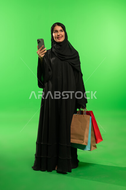 Saudi Woman with Shopping Bags on Green Screen