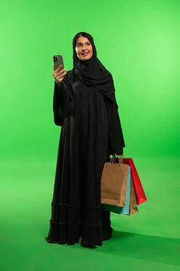 Saudi Woman with Shopping Bags on Green Screen
