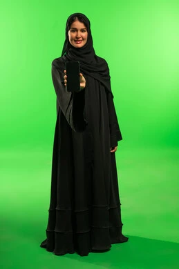 Saudi Woman Holding Smartphone on Green Screen Background