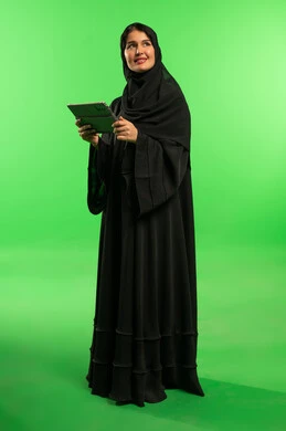 Saudi Woman with Tablet on Green Screen Background