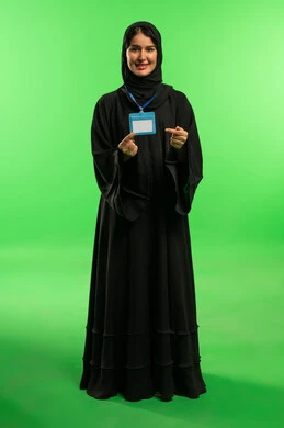 Saudi Woman in Black Abaya Holding ID on Green Screen