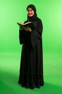Saudi Woman in Abaya with Book on Green Screen