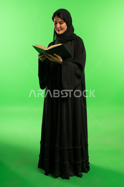 Saudi Woman Reading Book on Green Screen Background