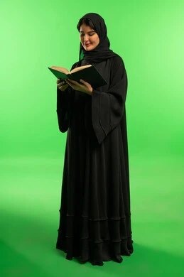 Saudi Woman Reading Book on Green Screen Background