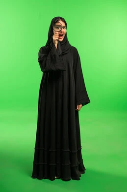 Saudi Woman with Magnifying Glass on Green Screen