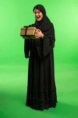 Saudi Woman in Abaya Holding Gift Box on Green Screen