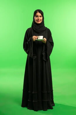 Saudi Woman in Black Abaya on Green Screen with Coffee