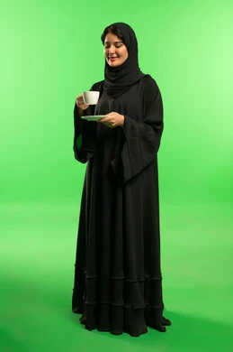 Saudi Woman in Abaya Holding Coffee Green Screen