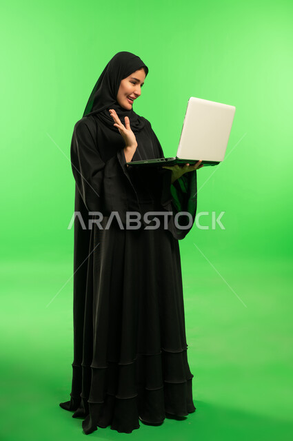 Saudi Woman with Laptop on Green Screen