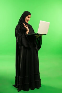 Saudi Woman with Laptop on Green Screen