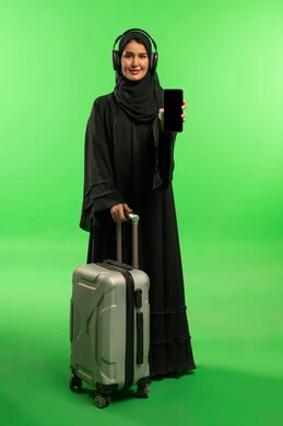 Saudi Woman with Suitcase and Smartphone on Green Screen