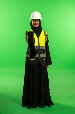 Saudi Female Engineer in Safety Gear on Green Screen