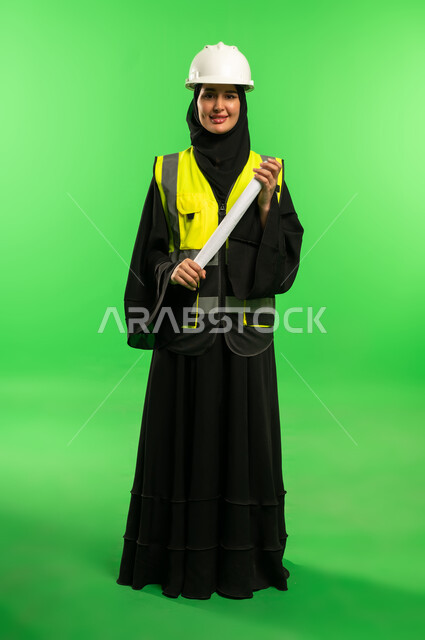 Saudi Female Engineer with Blueprint on Green Screen