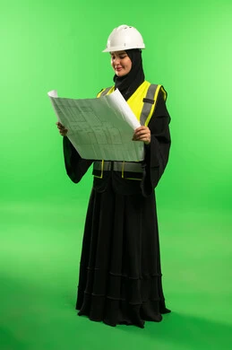 Saudi Female Engineer with Blueprints on Green Screen