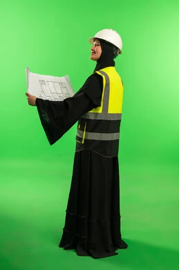 Saudi Female Engineer with Blueprints on Green Screen
