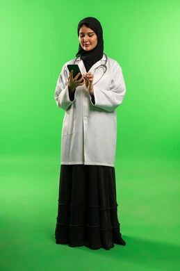 Saudi Female Doctor Using Smartphone on Green Screen
