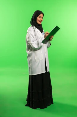 Saudi Female Doctor with Clipboard on Green Screen
