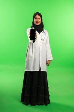 Saudi Female Doctor Holding Smartphone Green Screen