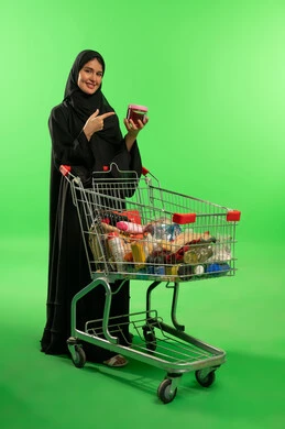 Saudi Woman with Shopping Cart on Green Screen Studio