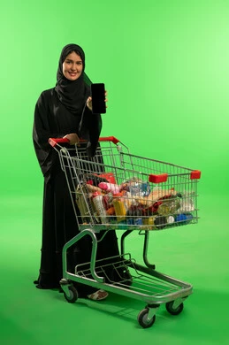 Saudi Woman with Shopping Cart on Green Screen
