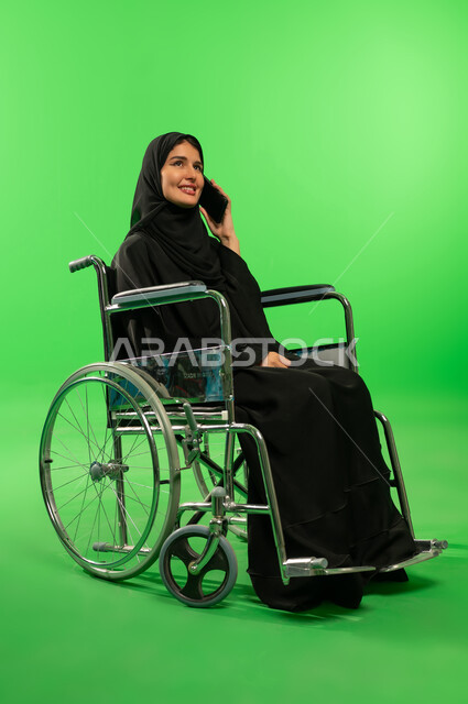 Saudi Woman in Wheelchair on Green Screen Background