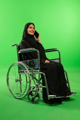 Saudi Woman in Wheelchair on Green Screen Background