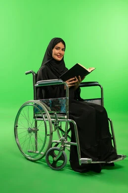 Saudi Woman in Wheelchair Reading on Green Screen