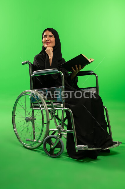 Saudi Woman in Wheelchair Reading on Green Screen