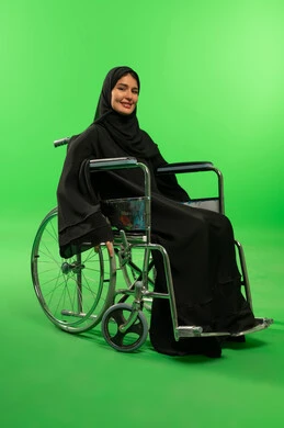 Saudi Woman in Wheelchair on Green Screen Background