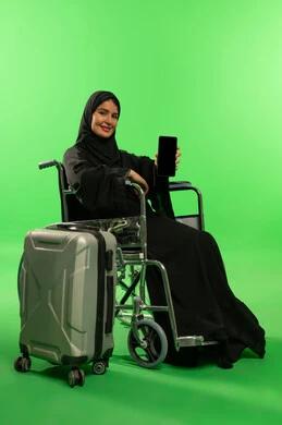 Saudi Woman in Wheelchair with Phone and Suitcase