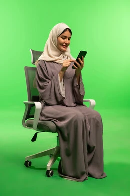 Saudi Woman Using Smartphone on Green Screen