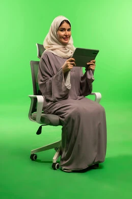 Saudi Woman with Tablet on Green Screen Background