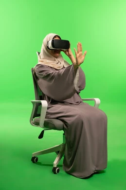 Saudi Woman Using VR Headset on Green Screen