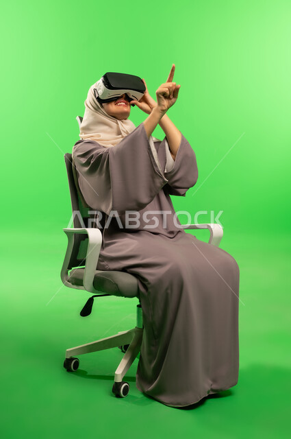 Saudi Woman Using VR Goggles on Green Screen