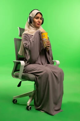 Sad Saudi Woman with Popcorn on Green Screen