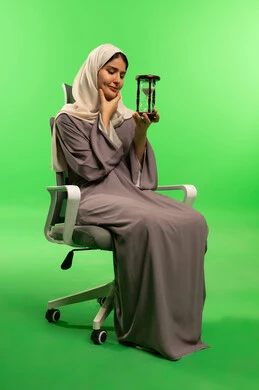 Saudi Woman with Hourglass on Green Screen