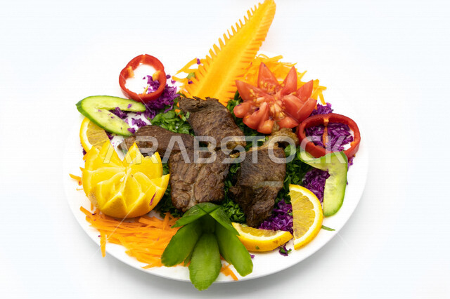 fried meat dish decorated with vegetables, Arabic meals, fried meat, recipes and delicious food dishes, delicious meals, Saudi Arabian Gulf restaurants, white background
