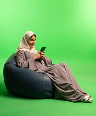 Saudi Woman Using Smartphone on Green Screen