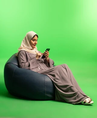 Saudi Woman Using Smartphone on Green Screen
