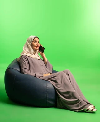 Saudi Woman Talking on Phone with Green Screen