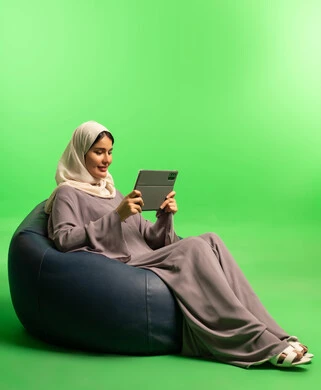 Saudi Woman with Tablet on Green Screen Background