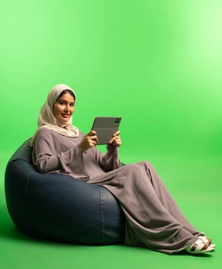 Saudi Woman with Tablet on Green Screen Beanbag