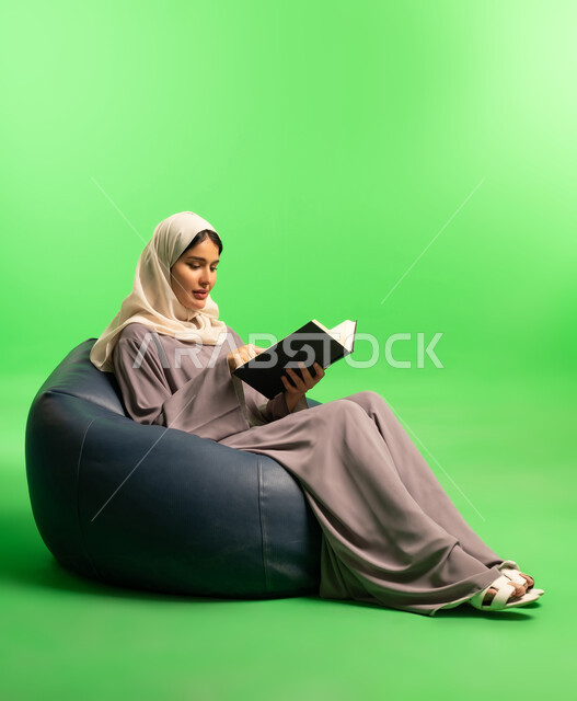 Saudi Woman Reading Book on Green Screen Background