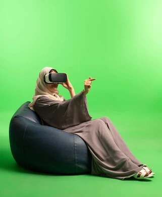 Saudi Woman Using VR Headset on Green Screen