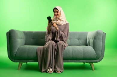 Saudi Woman Using Smartphone on Green Screen Background