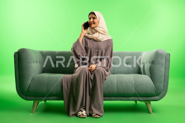 Saudi Woman Talking on Phone on Green Screen