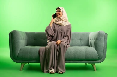 Saudi Woman Talking on Phone on Green Screen