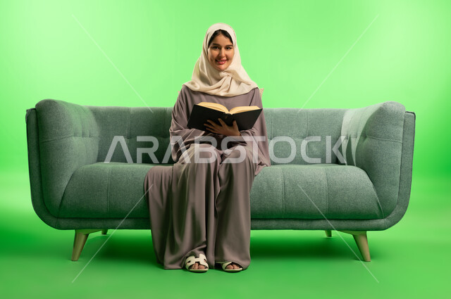 Saudi Woman Reading Book on Green Screen Background